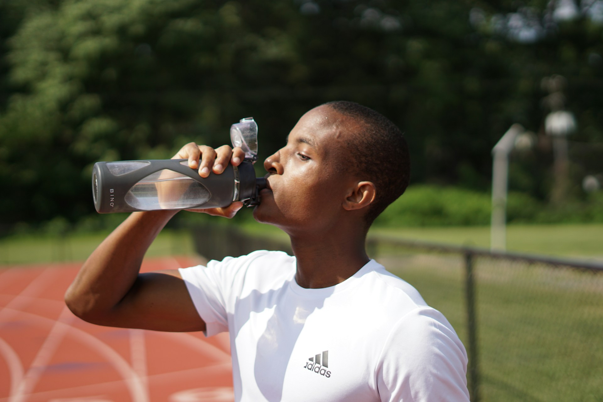 athlete drinking water
